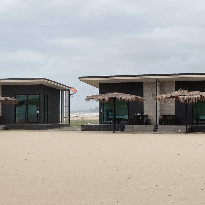 Sea-facing room buildings at Forest Beach Resort Pattani with glass walls onto the beach