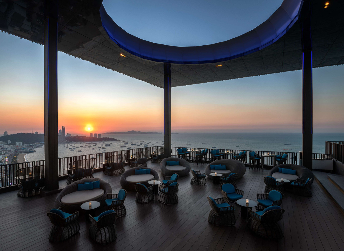 Rooftop terrace bar with sunset views over Pattaya Bay