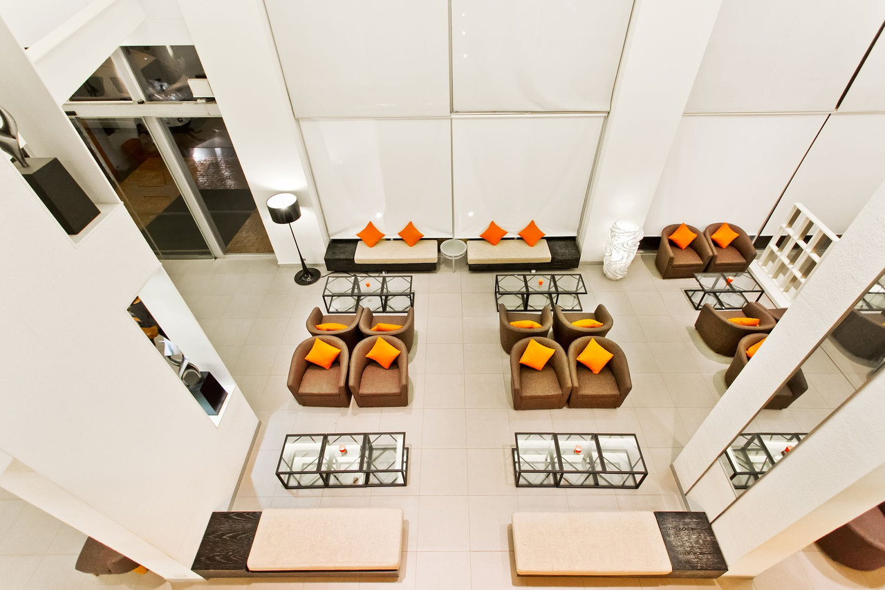 Ibis lobby lounge in the brand's orange-and-brown tones