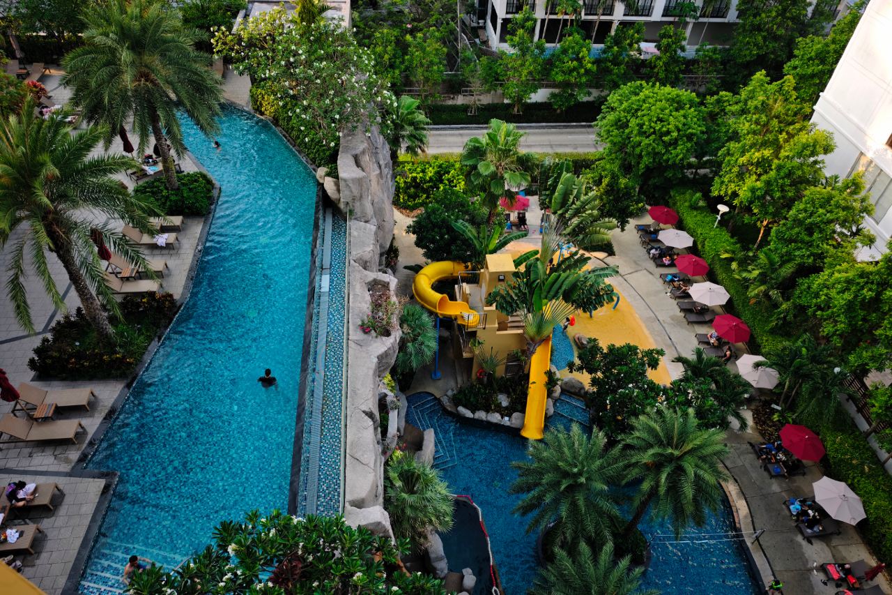 Aerial view of the lazy river and yellow water slide in the water park