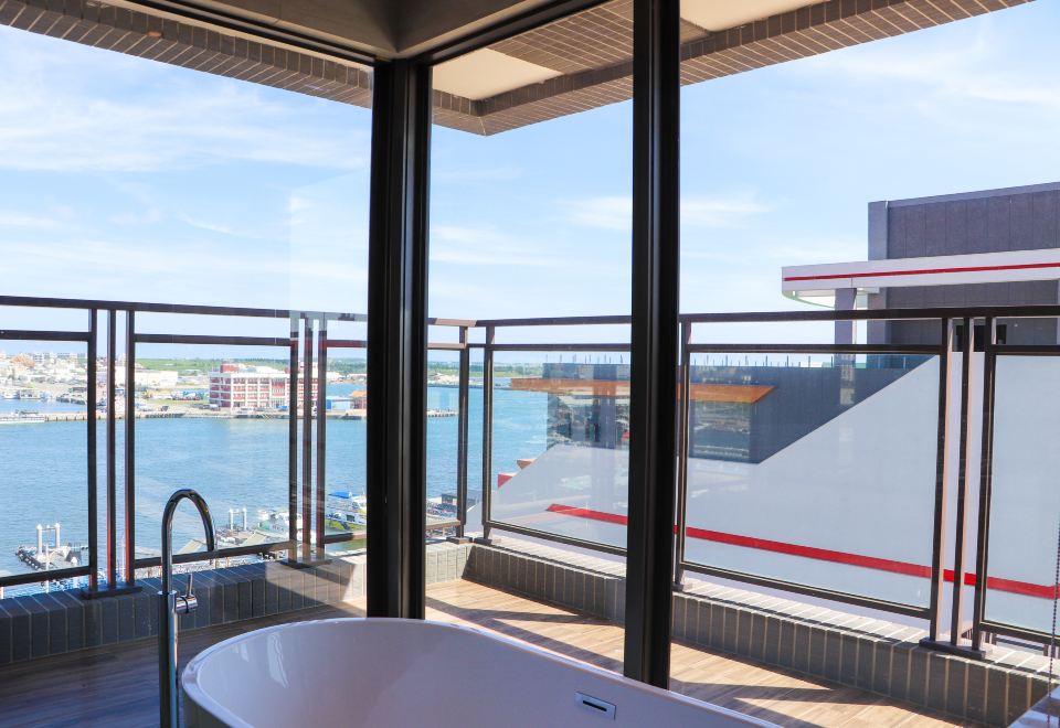 Penghu Loft Room with floor-to-ceiling windows overlooking the ferry pier