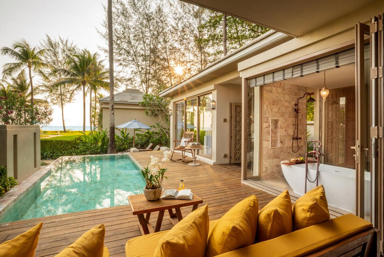 Beachfront villa with a private pool at sunset