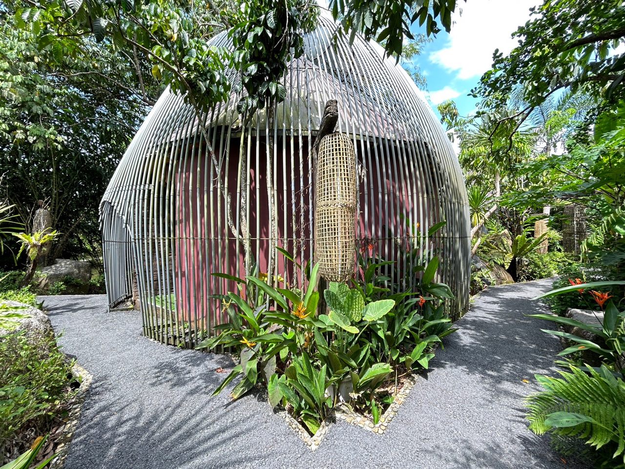Dome bamboo-frame cabana set among the resort's green garden