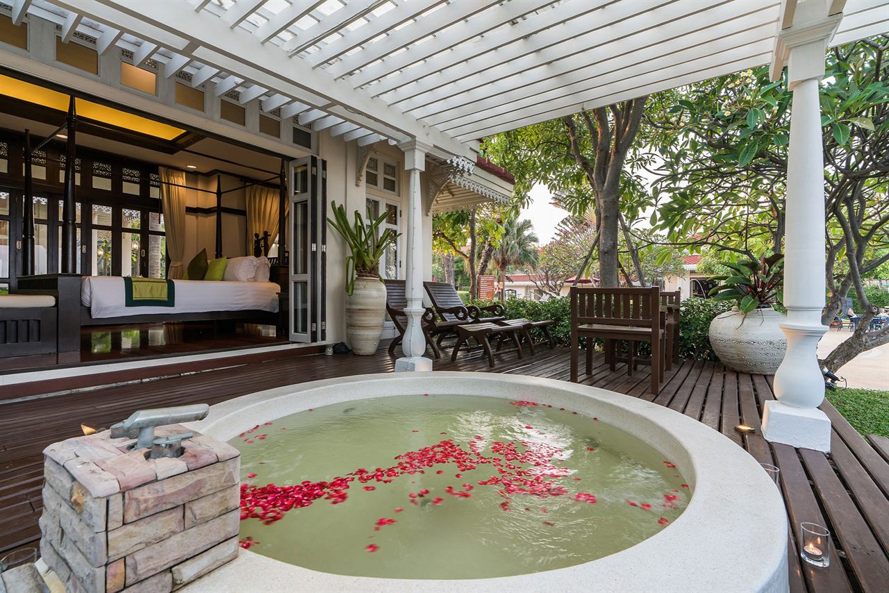Wora Bura villa with an outdoor soaking tub and a teak terrace beside the garden