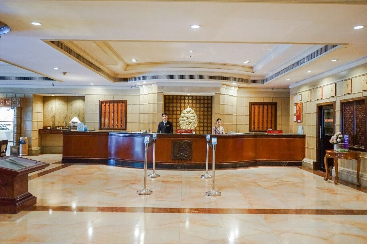 Lobby and reception desk at Topland Hotel Phitsanulok