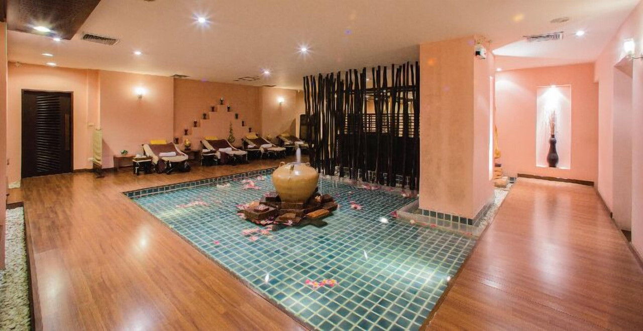 Thainess Spa treatment area with a lotus water feature in Thai style