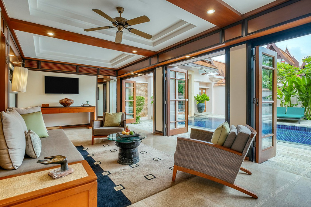 Villa living room opening out to a private pool