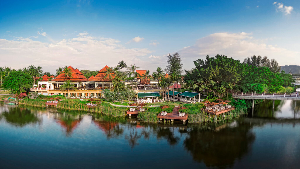Aerial view of the Thai-roofed resort on the Laguna lagoon