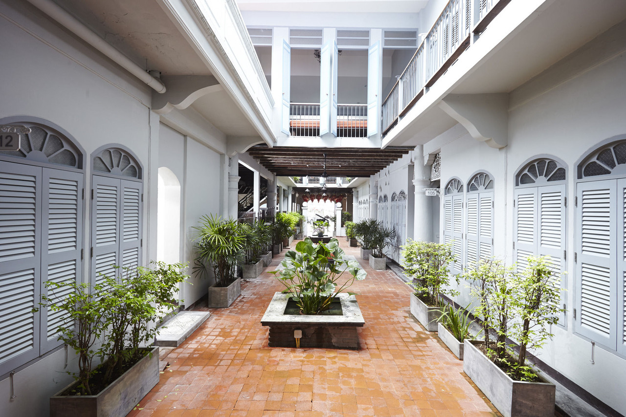 Central fountain courtyard with Sino-Portuguese louvered shutters