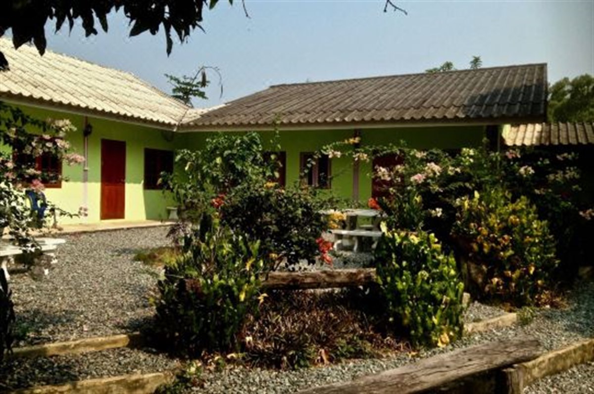 Thai-roofed bungalow among flowering gardens at Areeya Resort Sa Kaeo