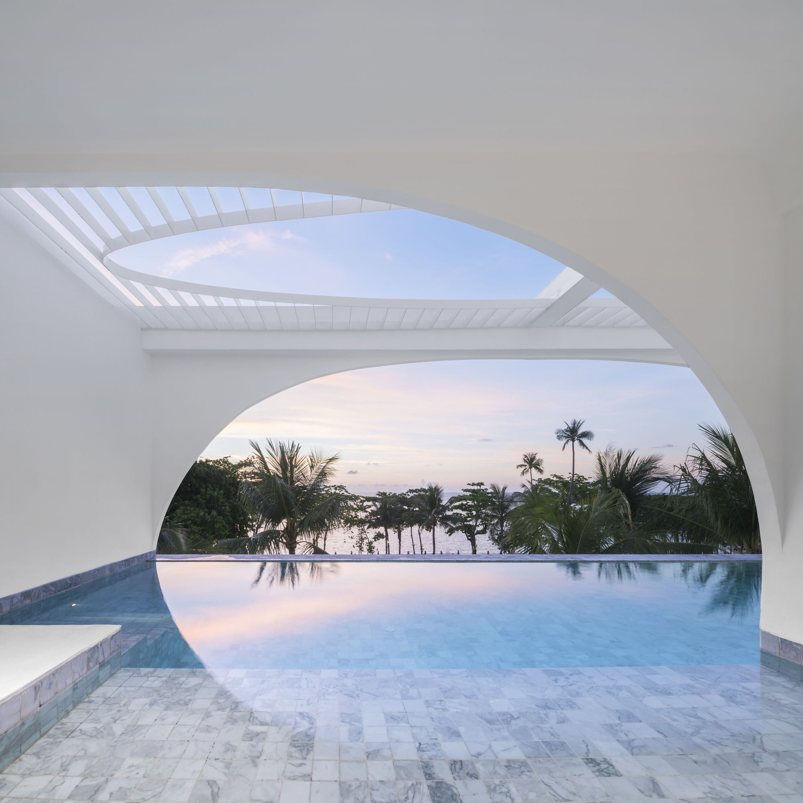 Private pool under a white crescent arch and circular skylight, Chaweng Beach