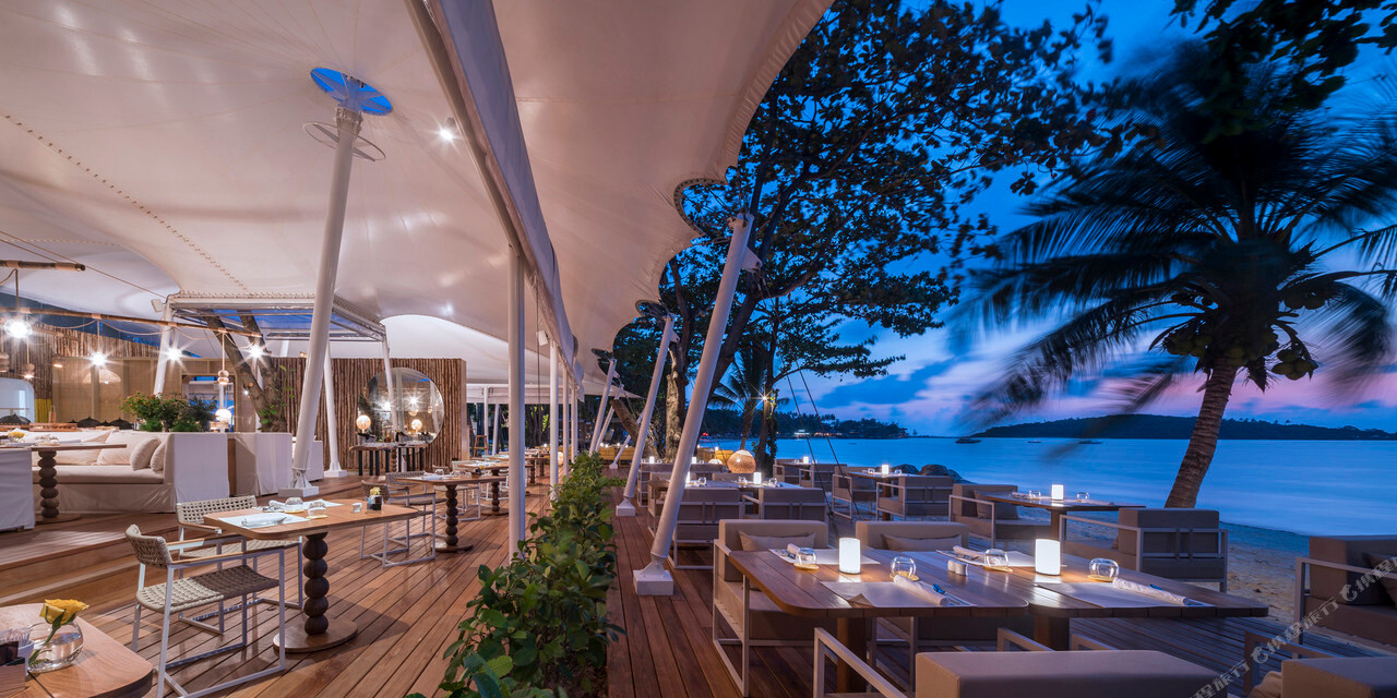 The Tent beachfront restaurant on Chaweng Beach at dusk