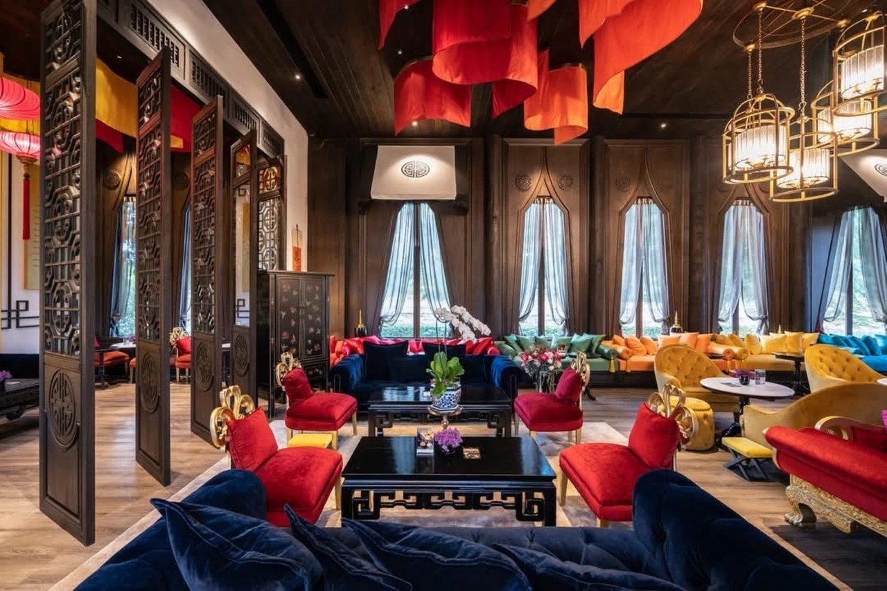 The Harmony tearoom with oriental design, lanterns and red drapes