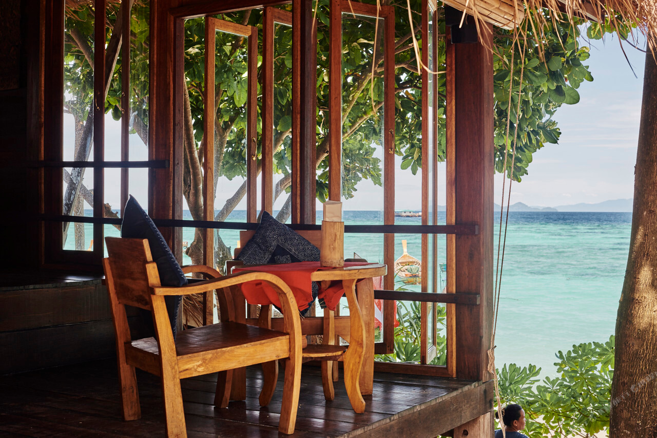 Wooden bungalow porch with sea view at Castaway Resort Koh Lipe, Sunrise Beach