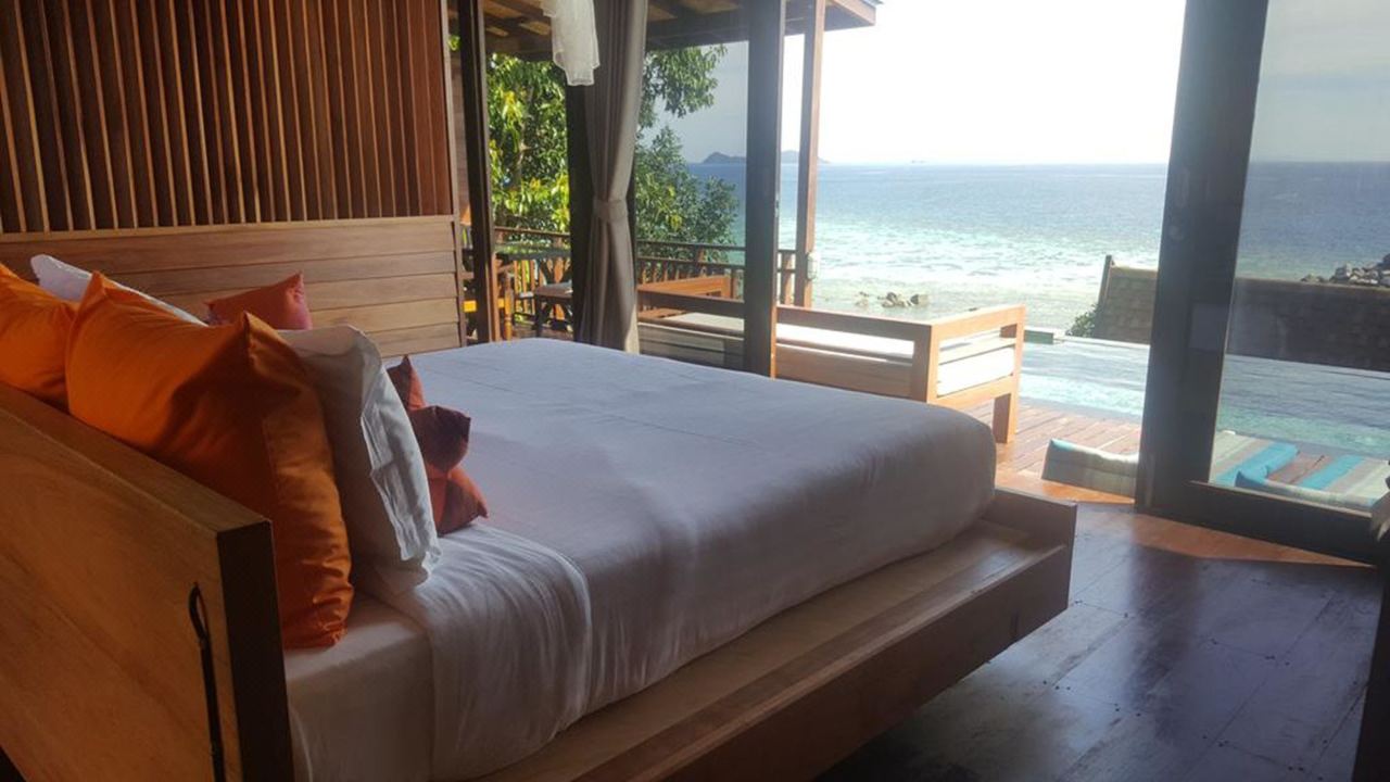 Pool villa bedroom with a private plunge pool by the sea