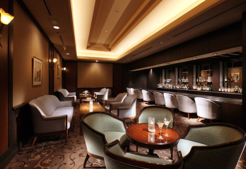 Hotel Metropolitan Sendai bar lounge with warm lighting and cream upholstered chairs