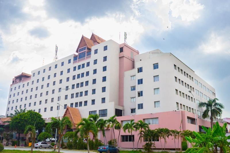 Songphanburi Hotel building in pink and white with a Thai-style roof crown