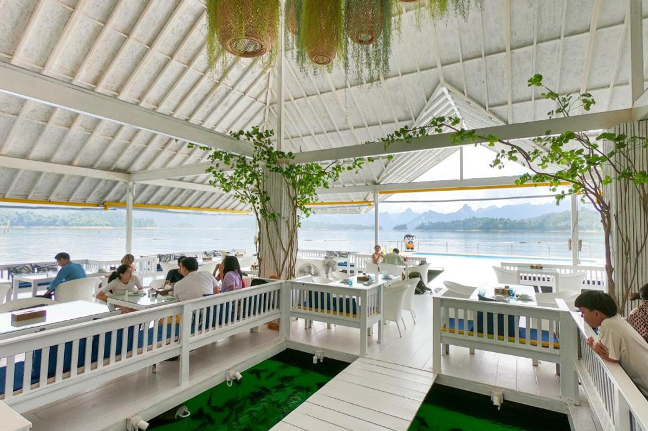 Inside the floating restaurant looking out at the lake and Khao Sok limestone peaks