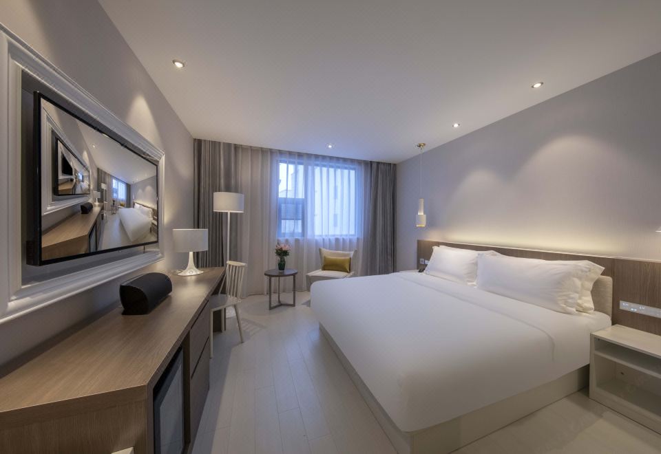 ล็อบบี้ Orange Hotel Select Suzhou Guanqian (苏州观前街桔子精选酒店) ดีไซน์โซฟาสีเขียวมรกตตัดทอง