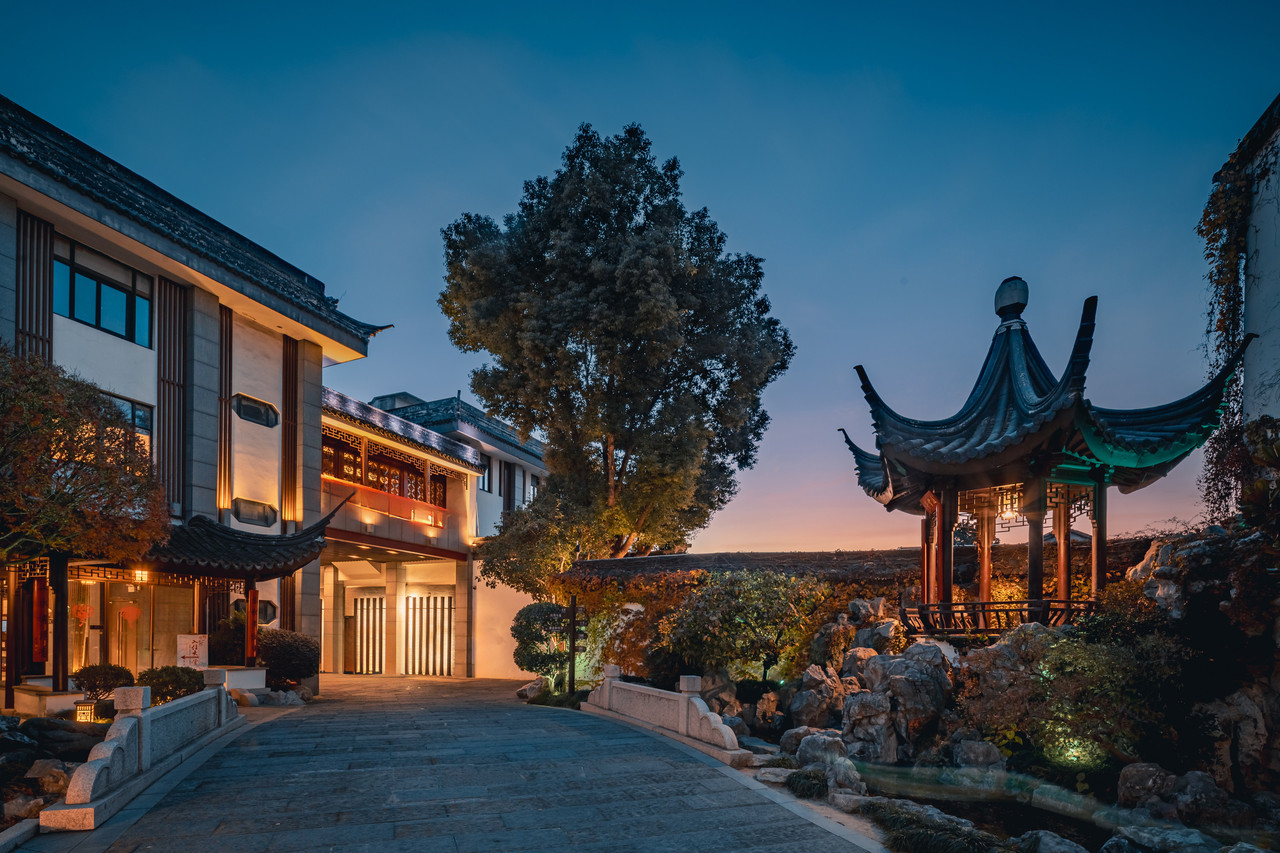 The Jiangnan-style entrance gate of Scholars Pingjiangfu, with red couplets and lanterns
