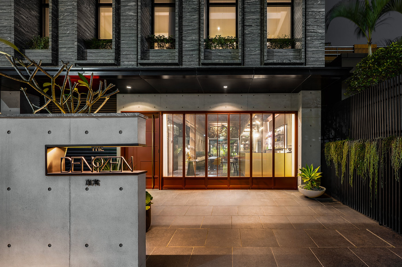 The Denizen studio — work corner with lush green view