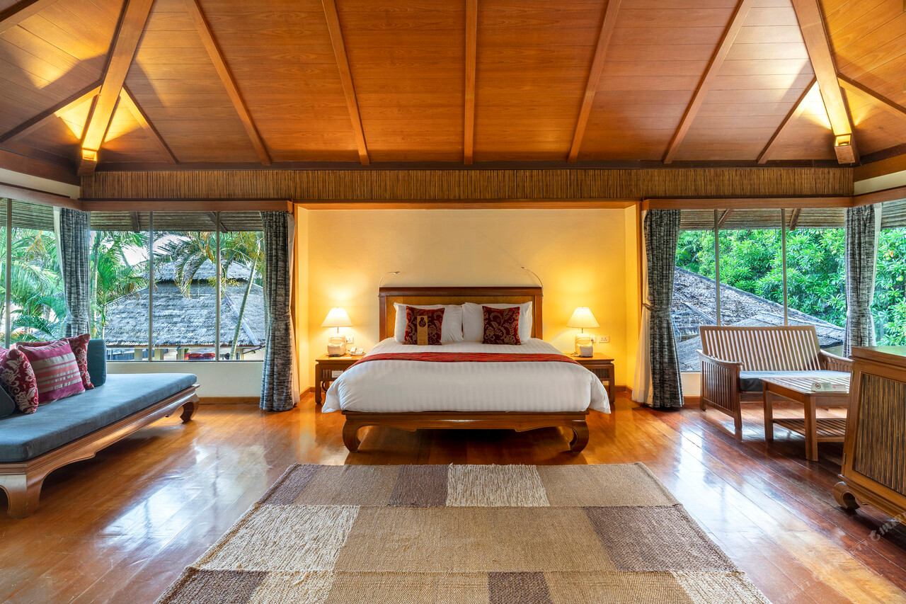 Thai-style timber cabana room with a vaulted teak ceiling