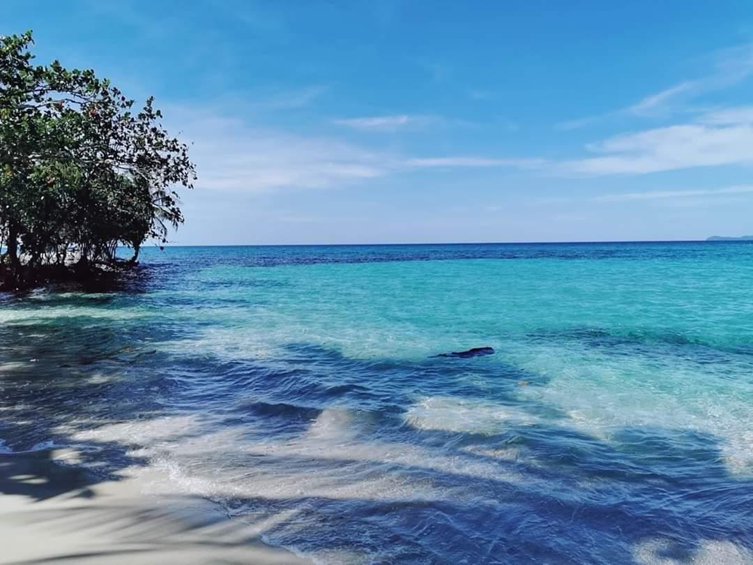 Ao Tapao Beach in front of Koh Kood Cabana with clear emerald-green water