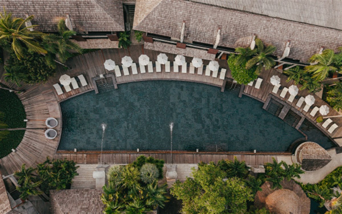 Aerial view of the 700 sqm black-tiled pool at The Dewa Koh Chang with water jets