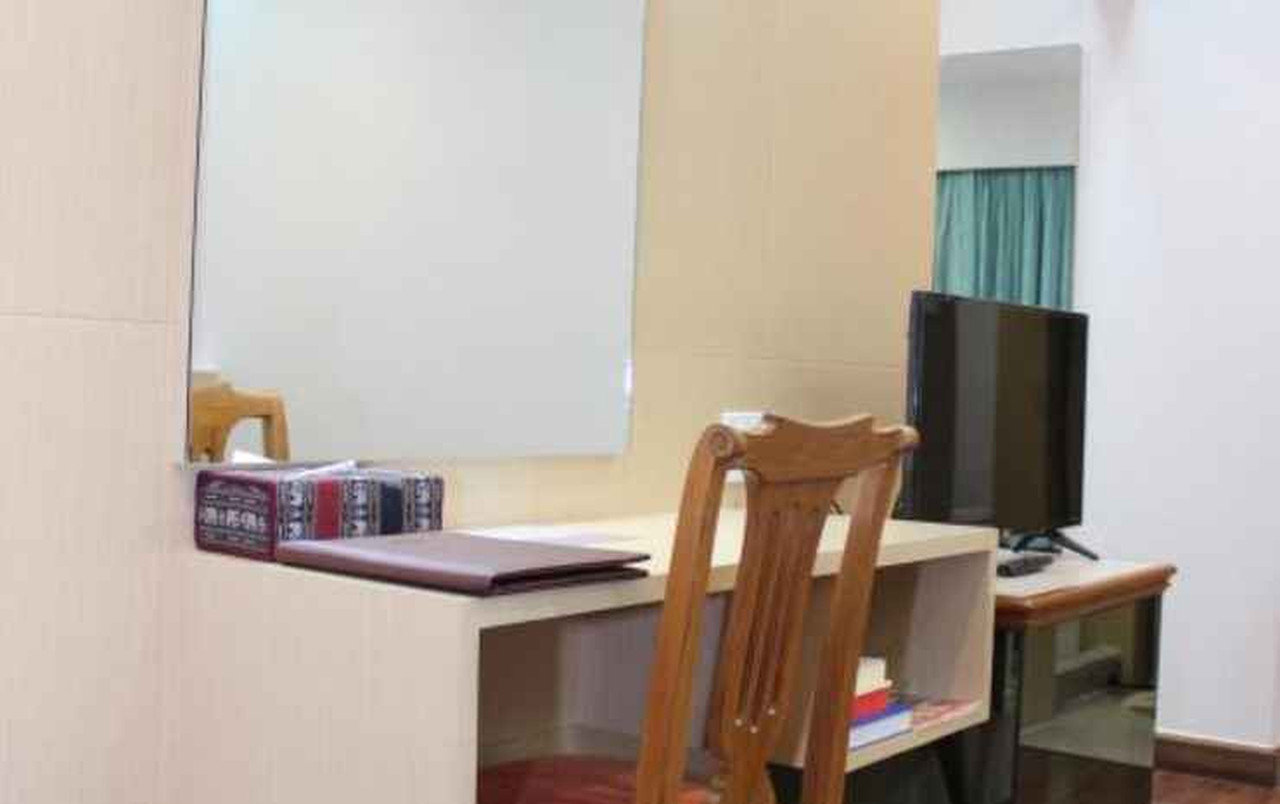 Standard guest room with work desk and TV