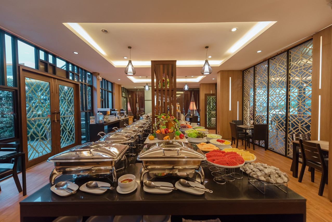 Pannavadee restaurant breakfast buffet with timber decor and Thai lattice screens