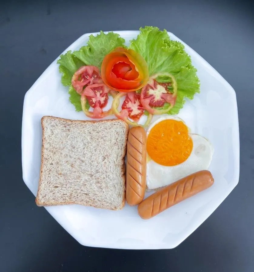 Plated Western breakfast set served to the room at TJ Boutique Hotel
