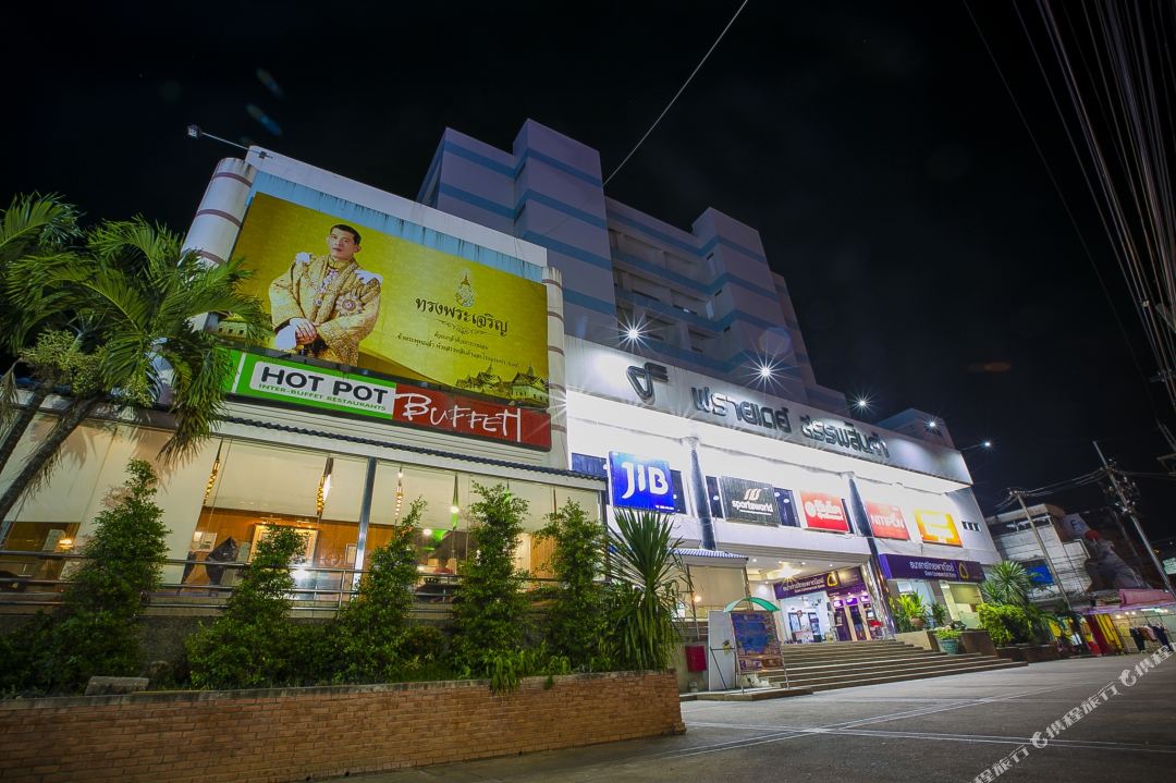 Friday Hotel building at night with the President department store and Hot Pot Buffet at street level