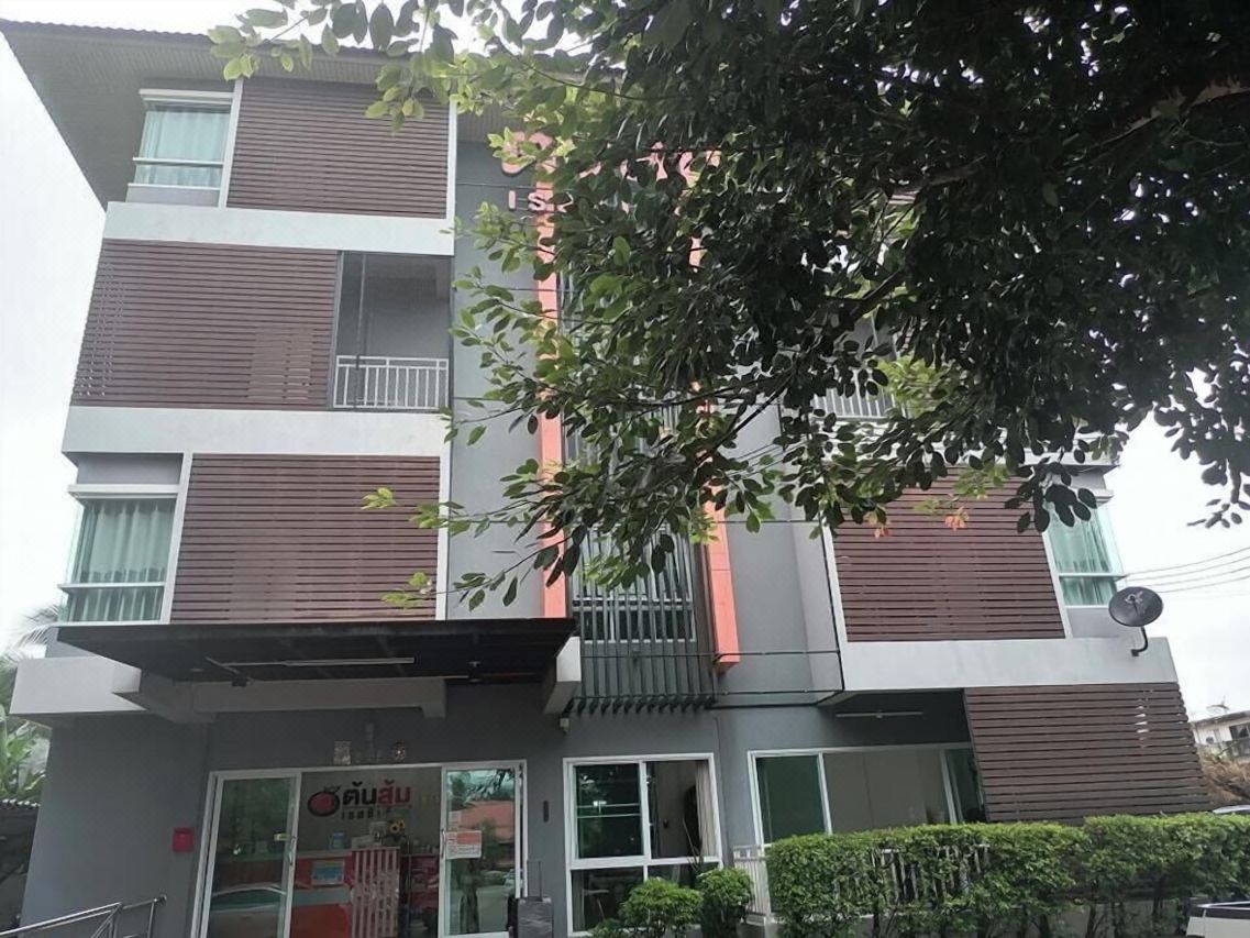 Front facade of Tonsom Residence Uttaradit with the orange Tonsom sign