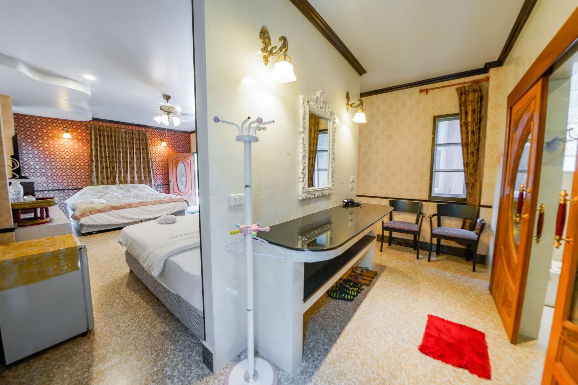 Spacious Deluxe room with dressing table and a seating corner