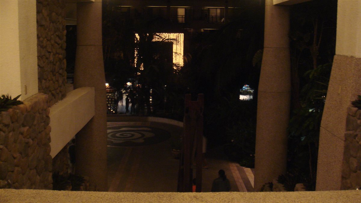 View from the stairs inside YOHO Beach Resort looking towards the sea and pools